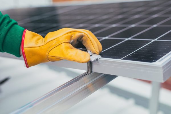 Electrician installing alternative energy solar panels
